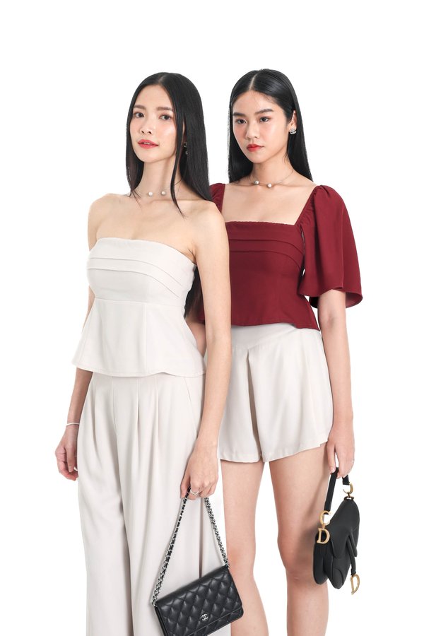 (PREORDER) *TPZ* TRINITY PEPLUM SLEEVELESS TOP IN IVORY PEARL